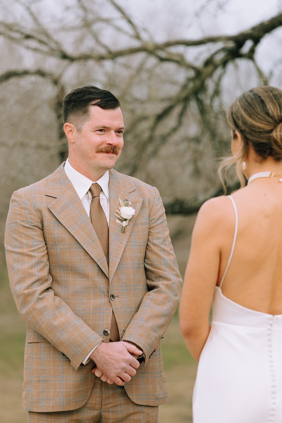 couple exchanges vows at outdoor wedding