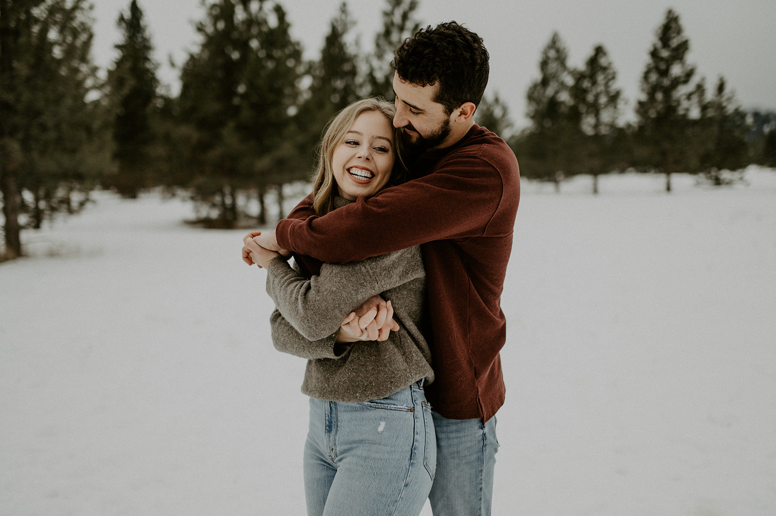 A couples engagement session in Missoula at Blue Mountain Recreational Area with pups