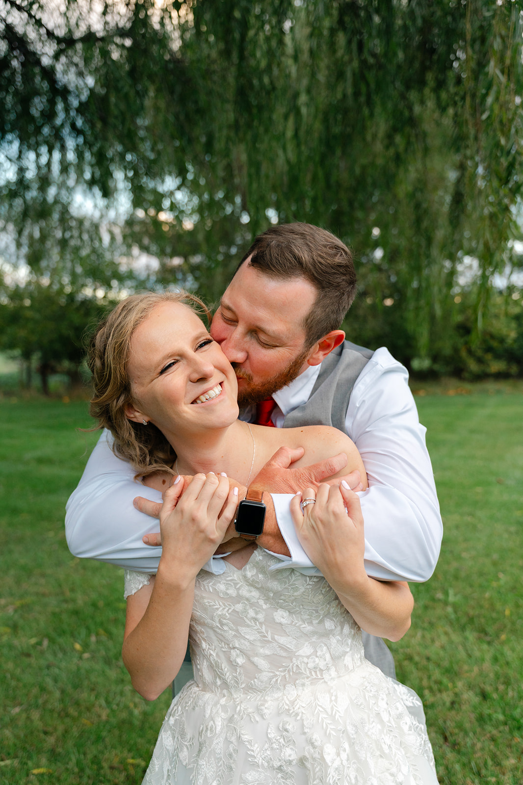Couple snuggles in close at wedding in Winchester, Virginia