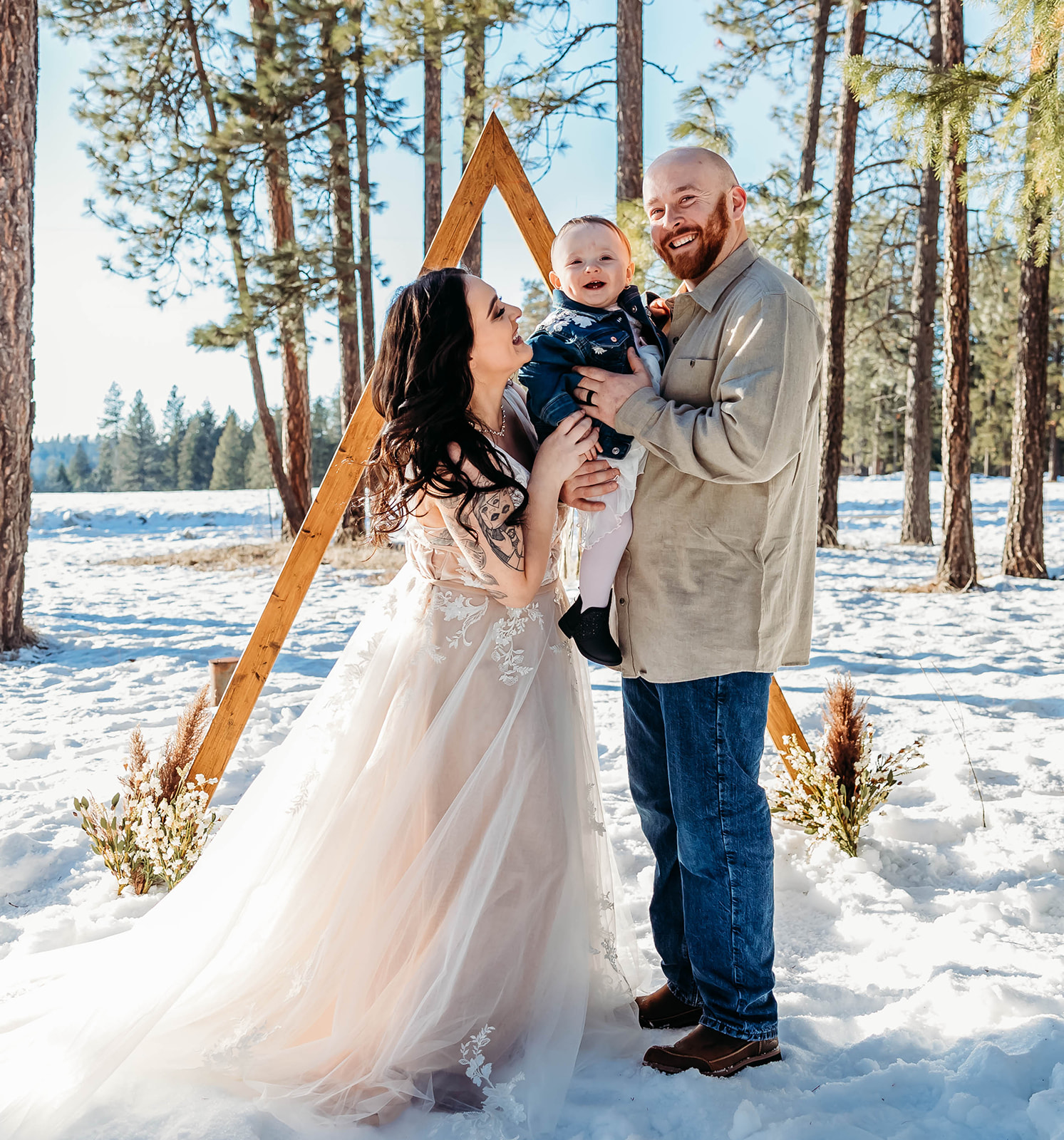 Couple with their daughter in their front yard in Spokane, Washington