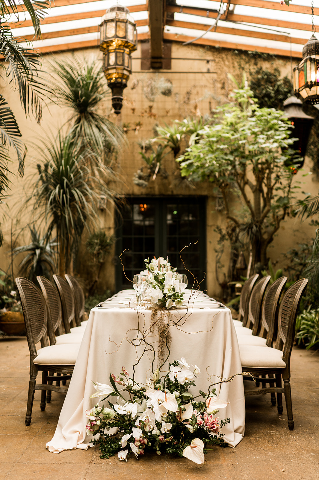 Stunning neutral wedding tablescape with florals inside wine tasting room of boutique winery outside Oregon City, Oregon
