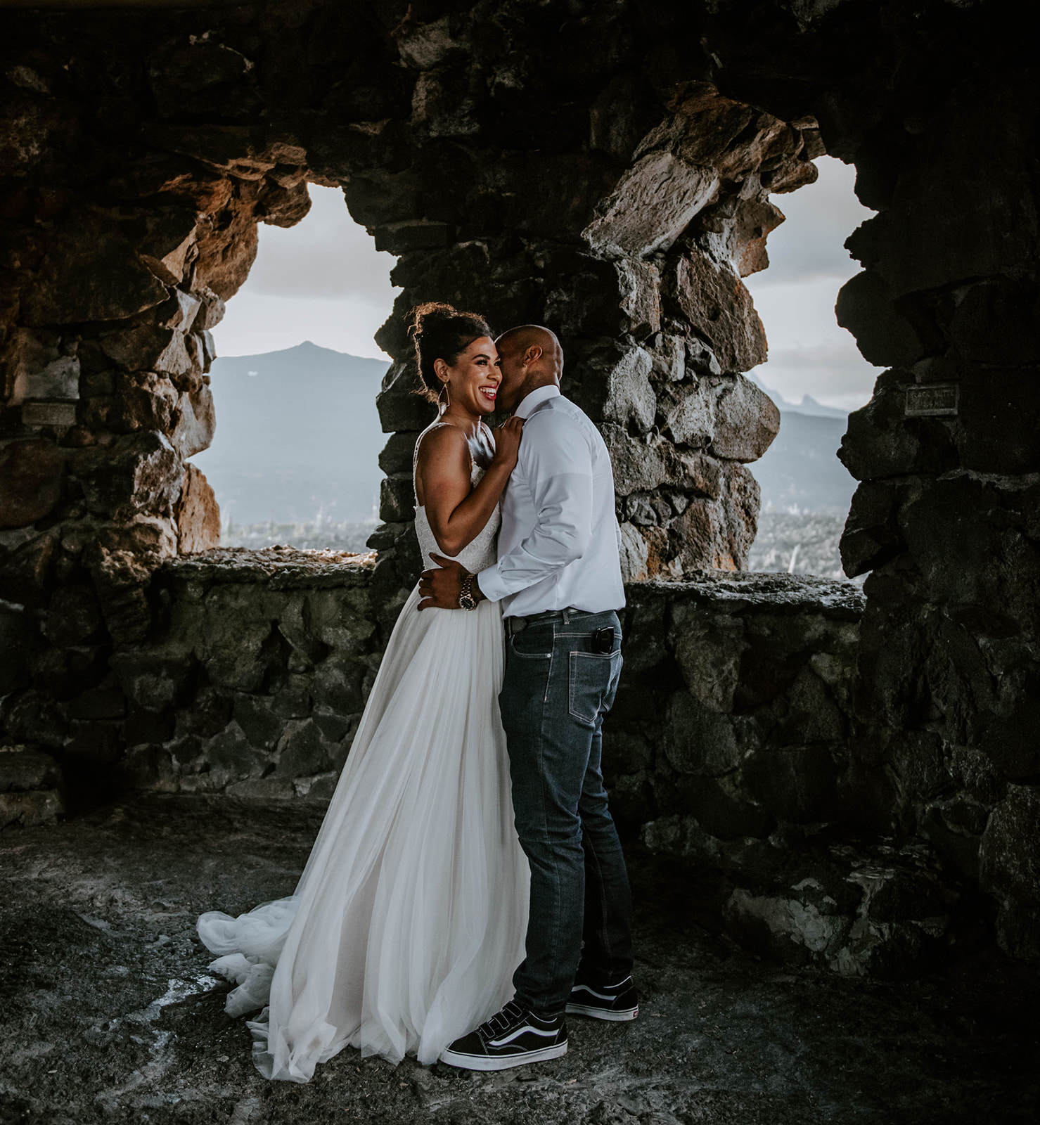 A bride and groom inside of the Oregon lava rock castle - Dee Wright Observatory