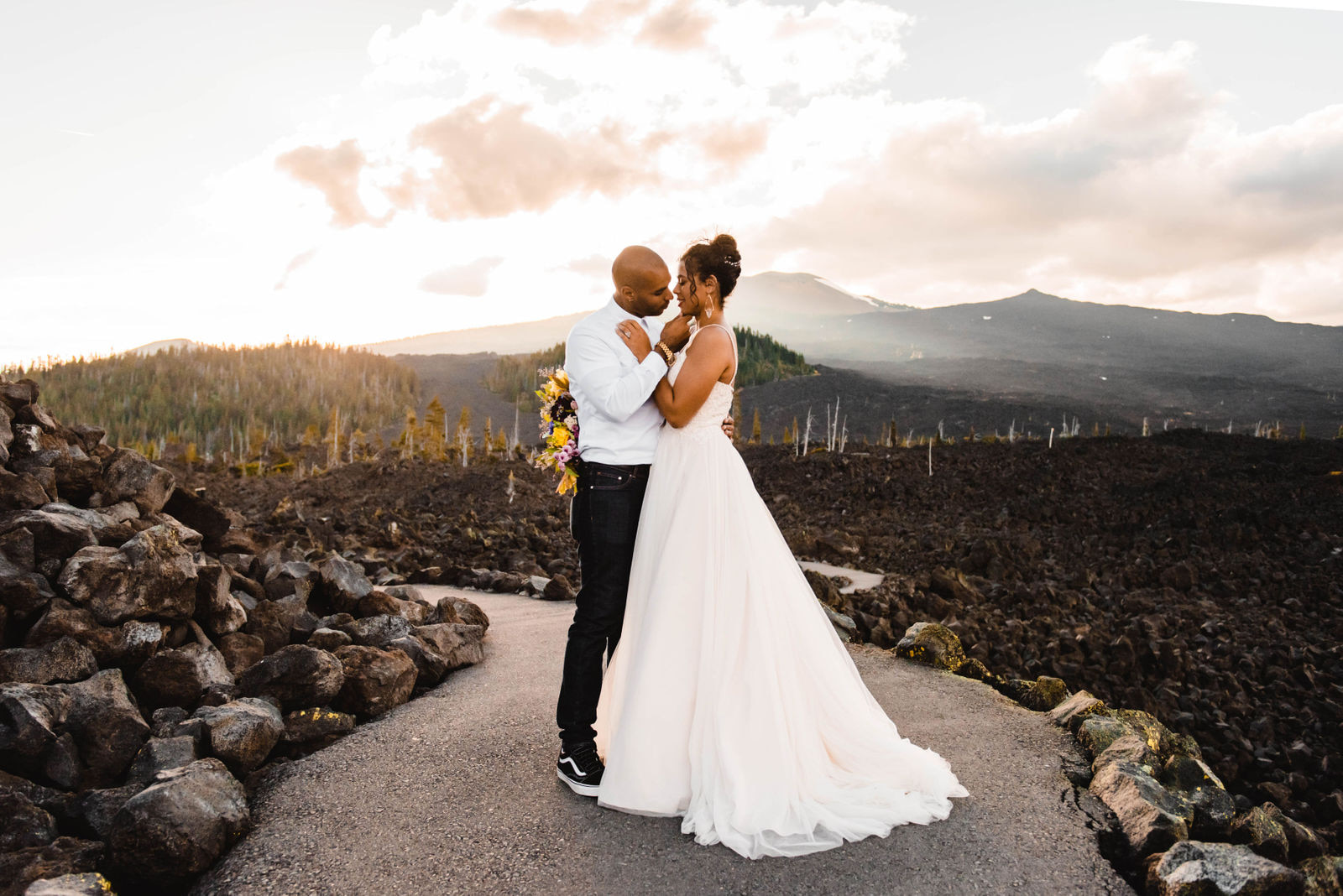 A couple who eloped at the Lava beds outside of Sisters, Oregon on the McKenzie Pass National Scenic Byway at sunset