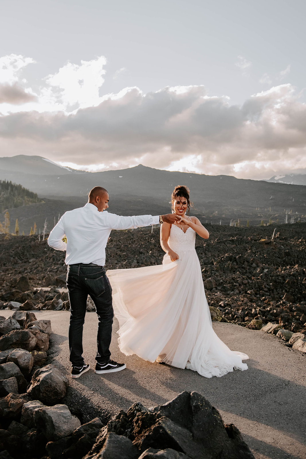 A couple who eloped at the Oregon lava beds dancing at sunset
