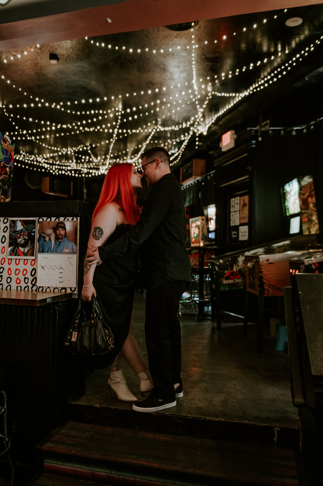 Couple kissing at wedgehead bar in Portland 