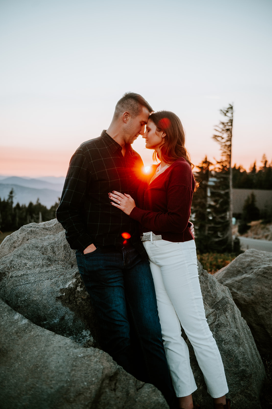 Couple embracing on Mt. Hood at sunset