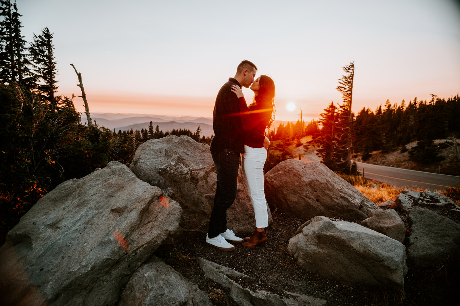 Couple kissing on Mt. Hood at Timberline Lodge at sunset