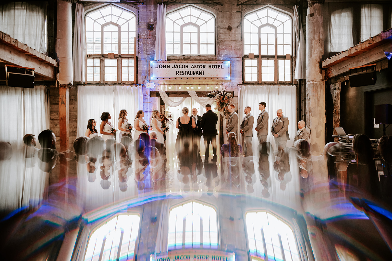 Wedding ceremony at the ruins at the Astor with reflections