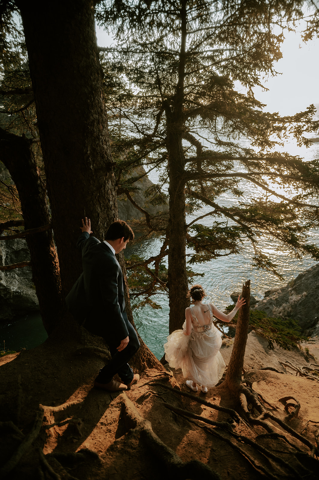 Bride and groom hiking for an adventure elopement on the Oregon coast