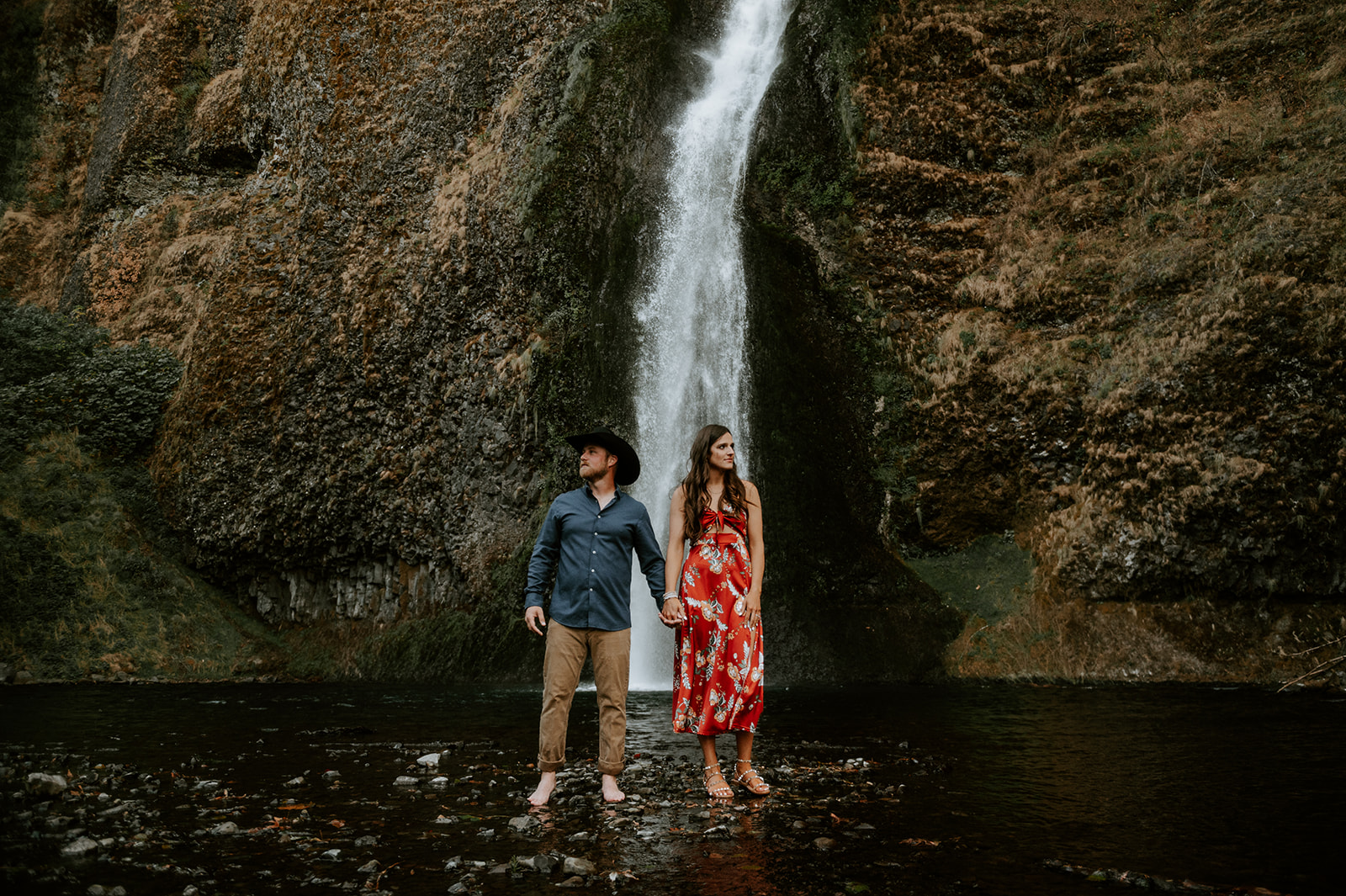 Dramatic couple engagement photos at the base of horsetail falls in the Colombia river gorge 