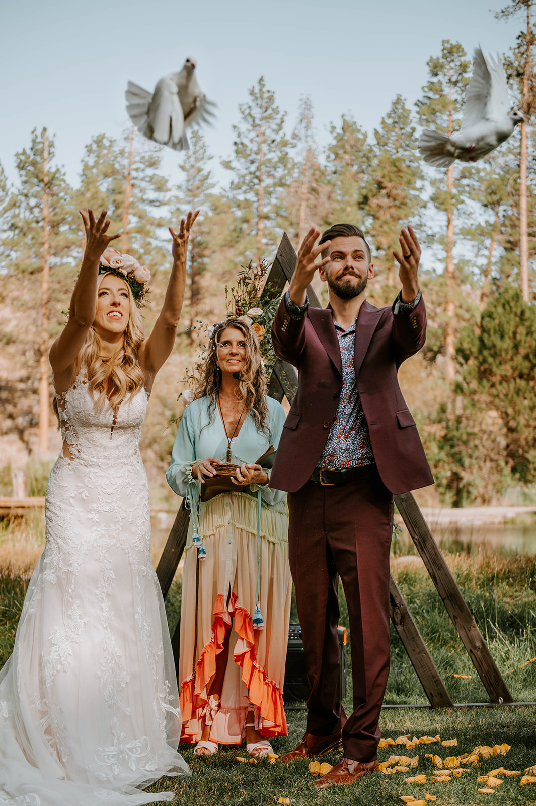 Bride and groom releasing doves during their wedding ceremony at aspen hall in bend oregon