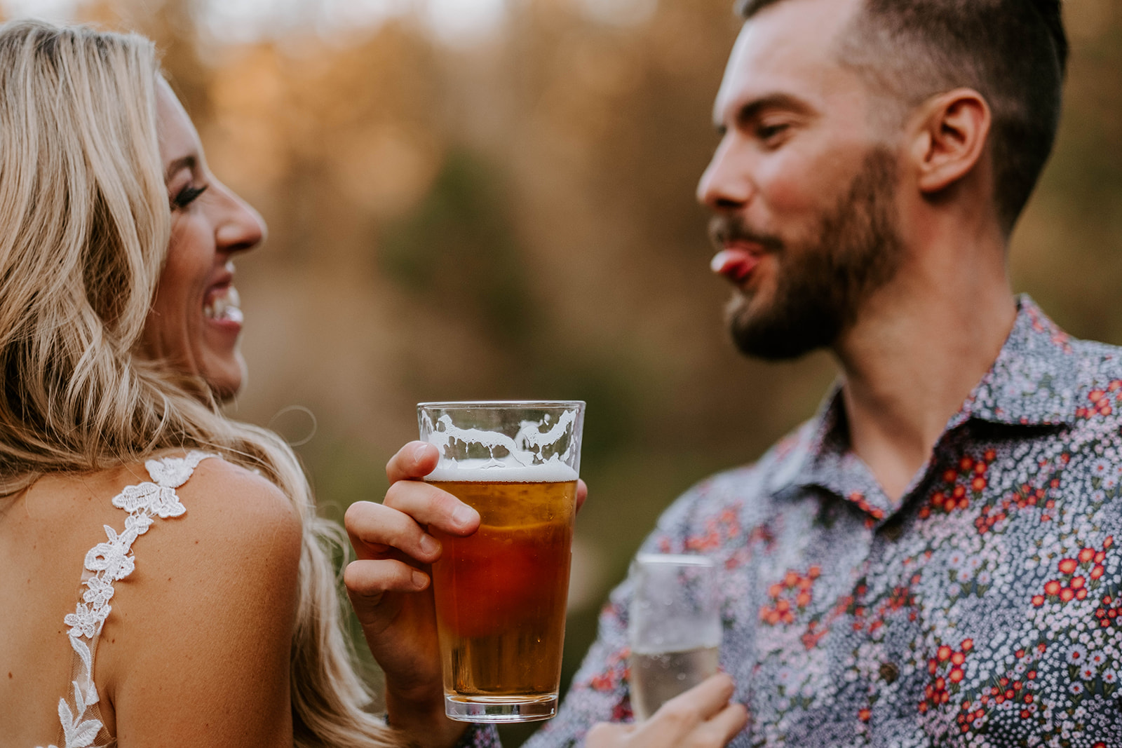 Groom sticking tongue out at bride while drinking an IPA in Bend