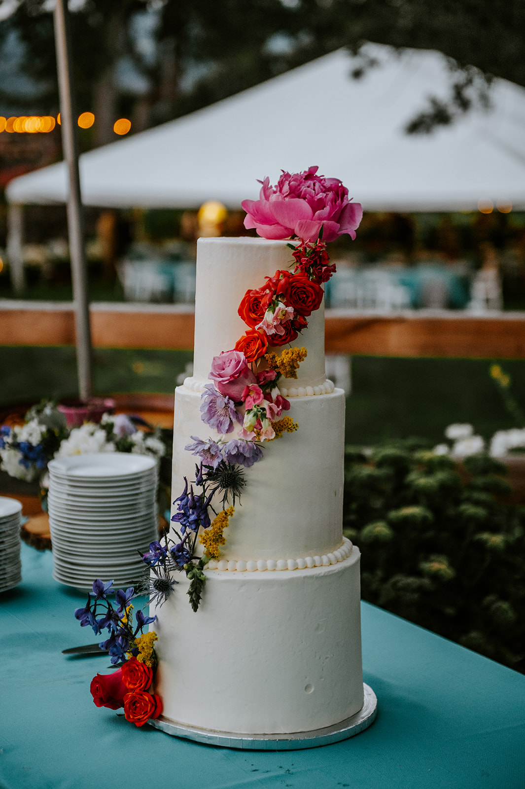 Rainbow flower three tier wedding cake