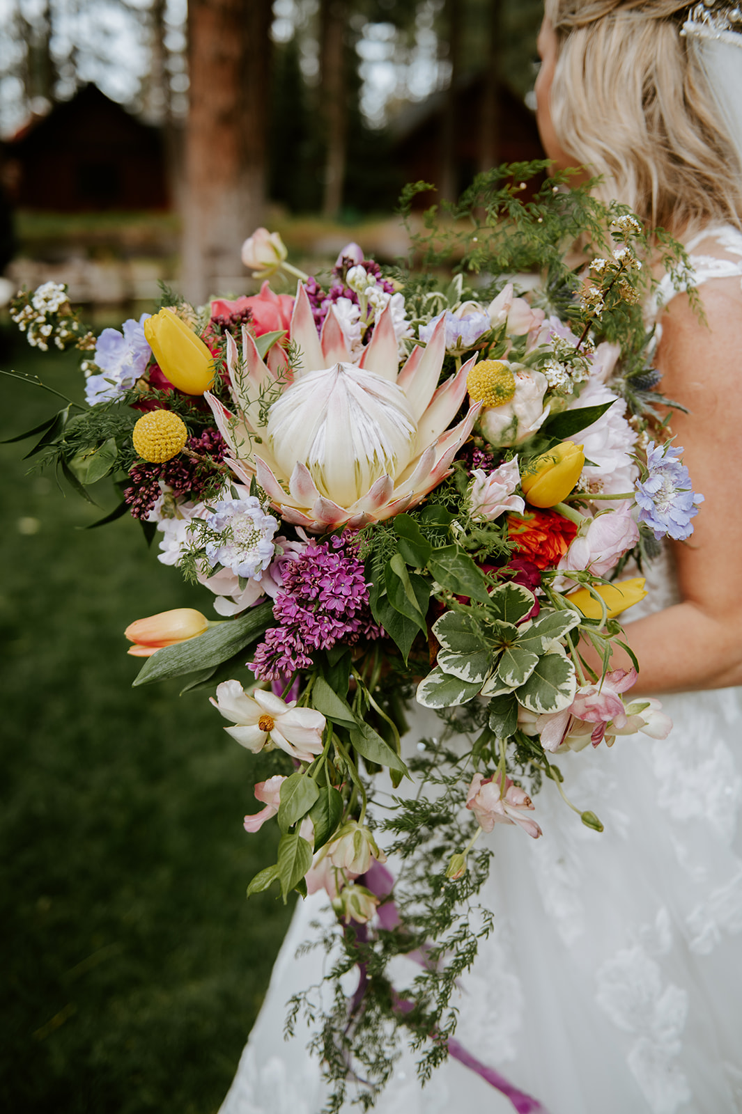 Colorful spring bridal bouquet with king protea