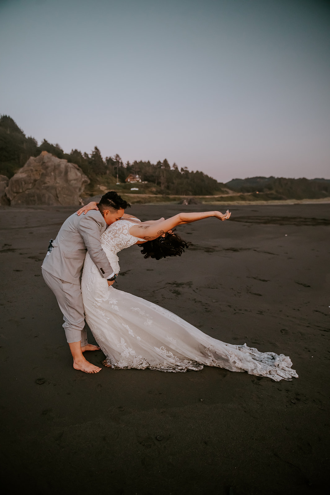 Two free spirited brides on the Oregon coast at dusk
