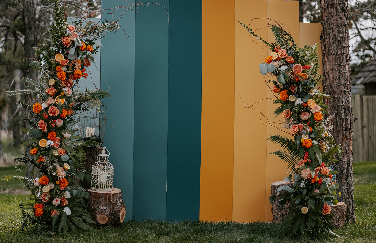 Unique DIY wedding arbor with citrus fruits and flowers