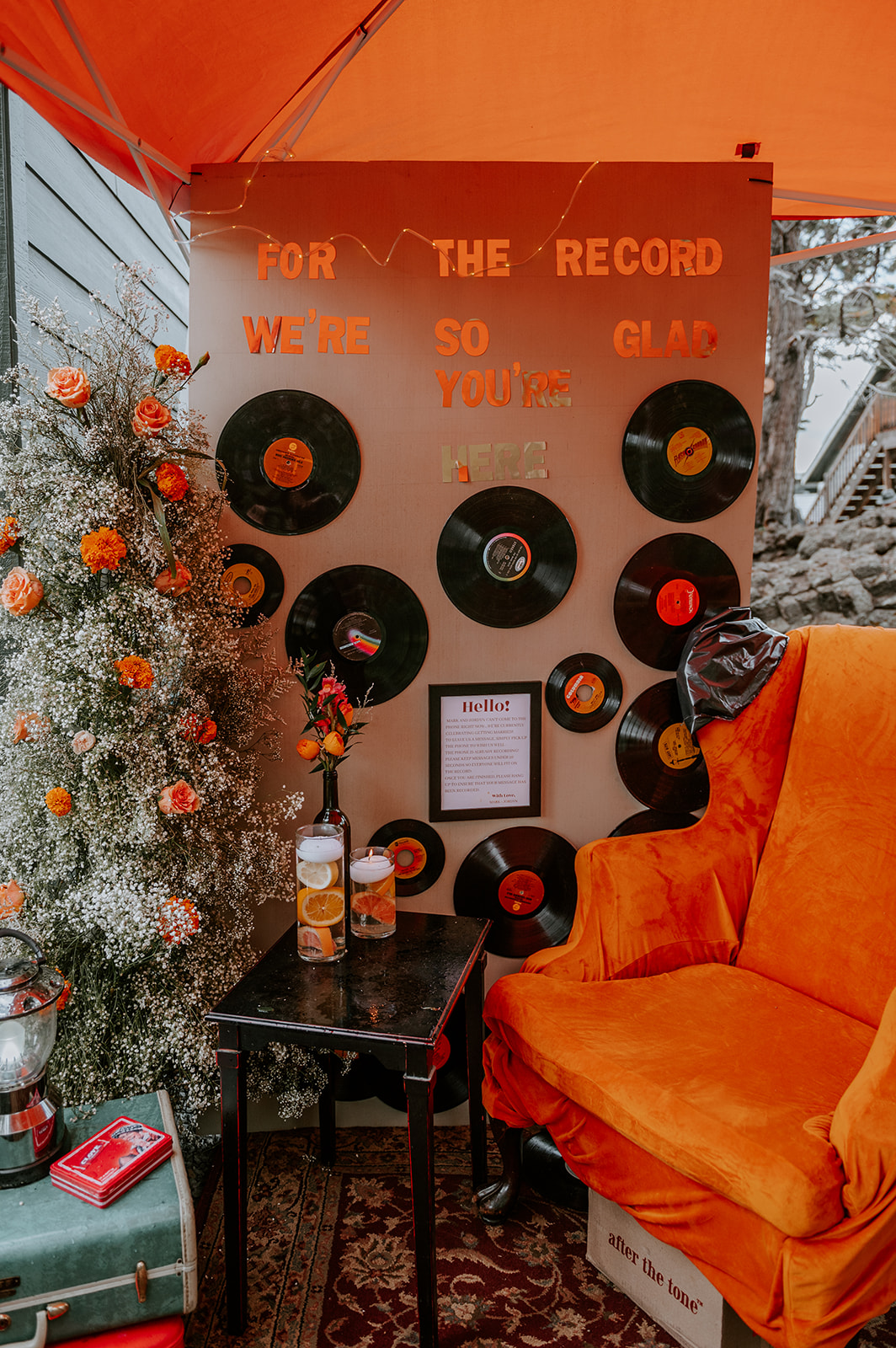 Vintage thrift store wedding decor that is orange. Vinyl records