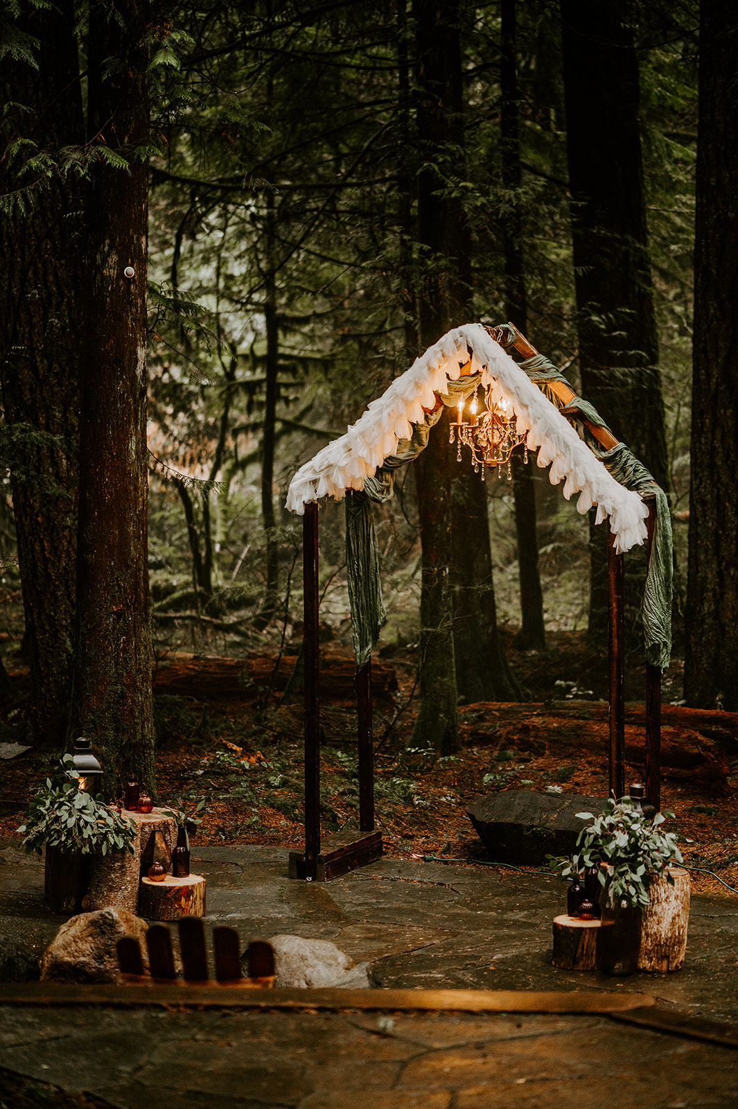 DIY wedding alter with a chandelier intimate wedding ceremony in Oregon woods