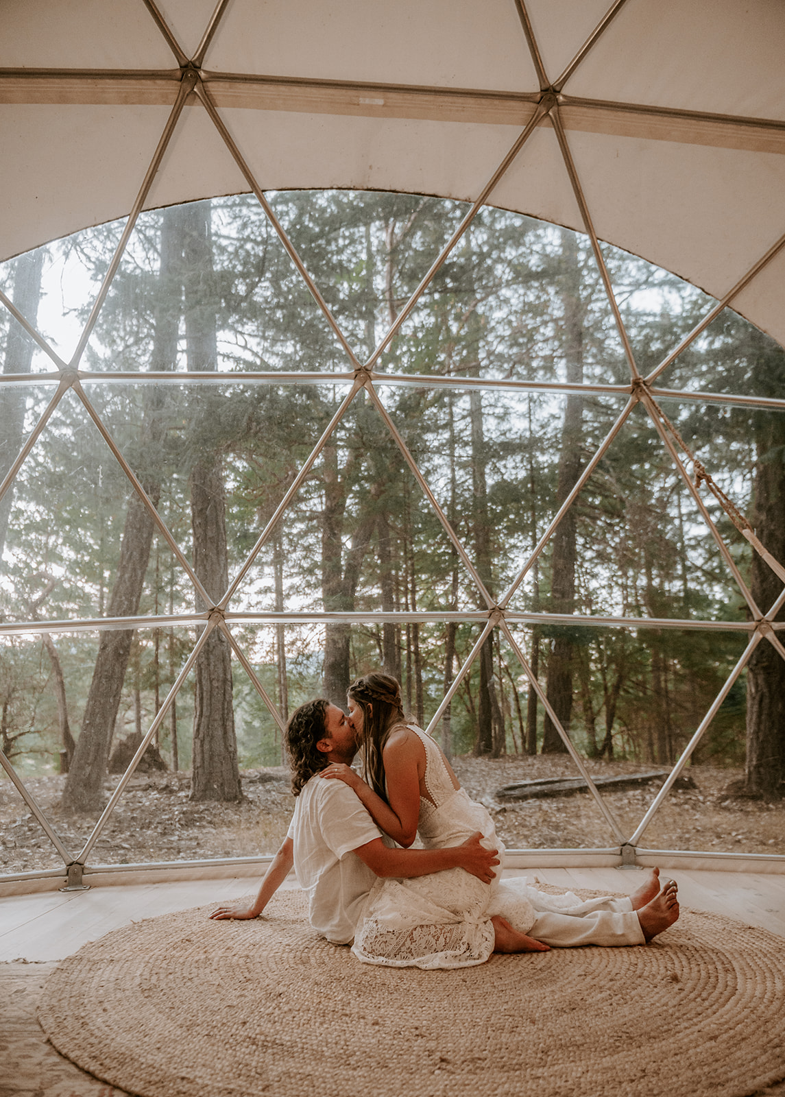 Bride and groom inside the large glamping dome at cedar bloom farms