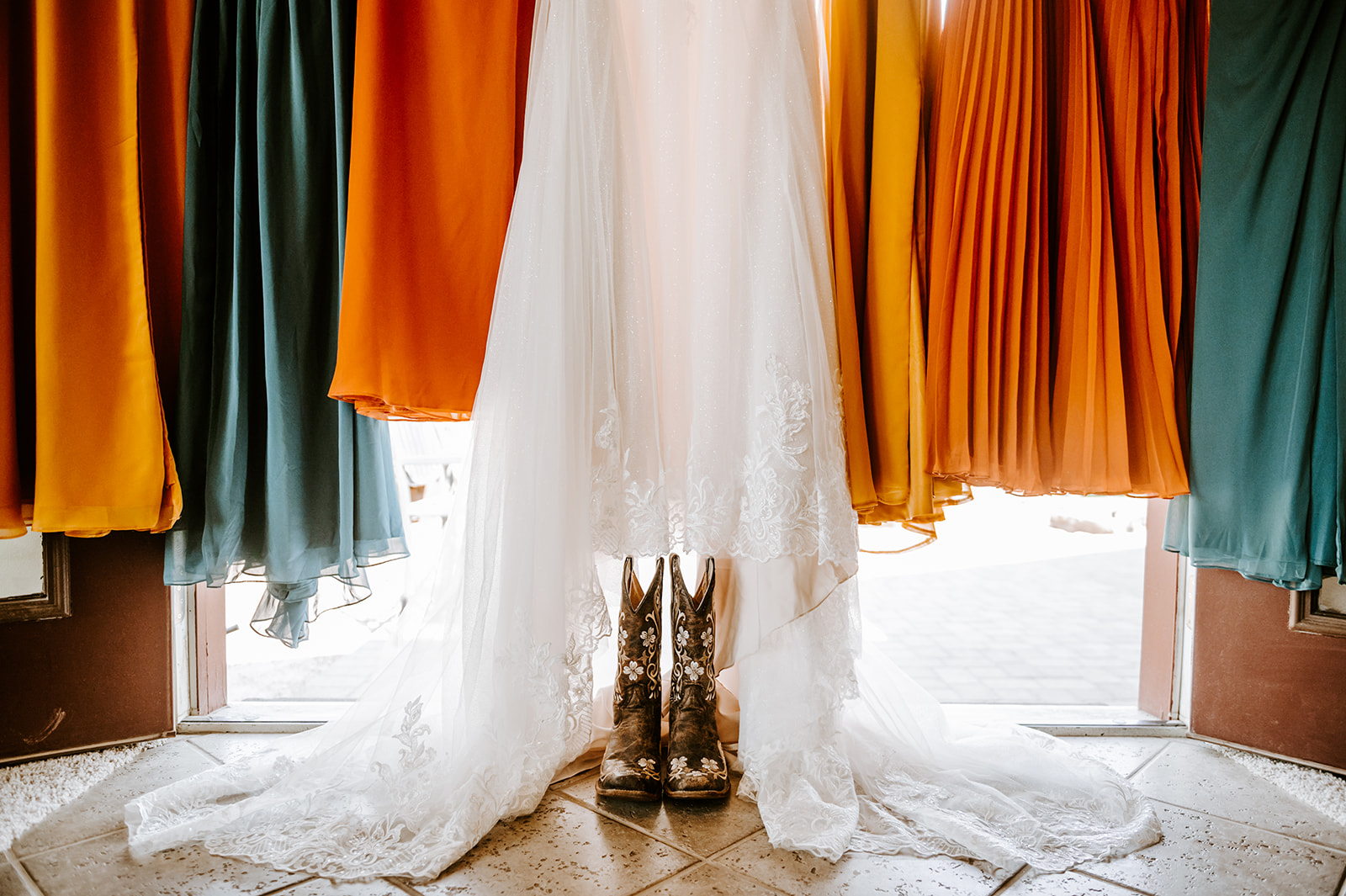 Brides and bridesmaid dresses with cowboy boots  