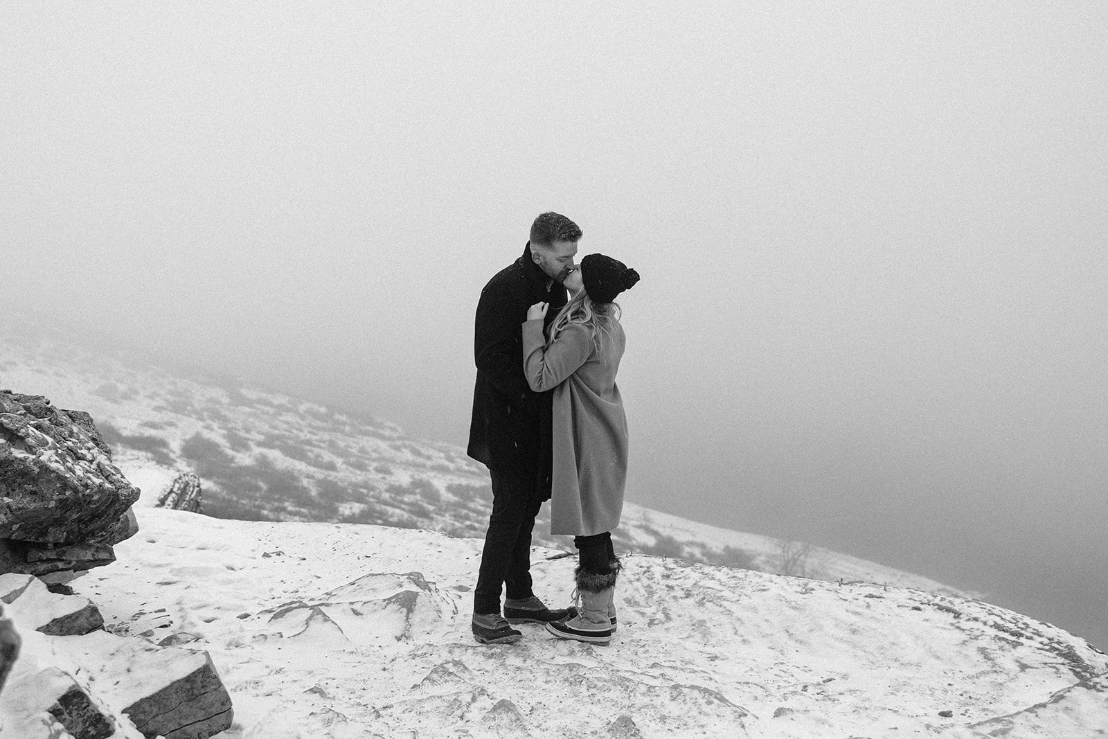 man and woman kissing in the mountains of Colorado 