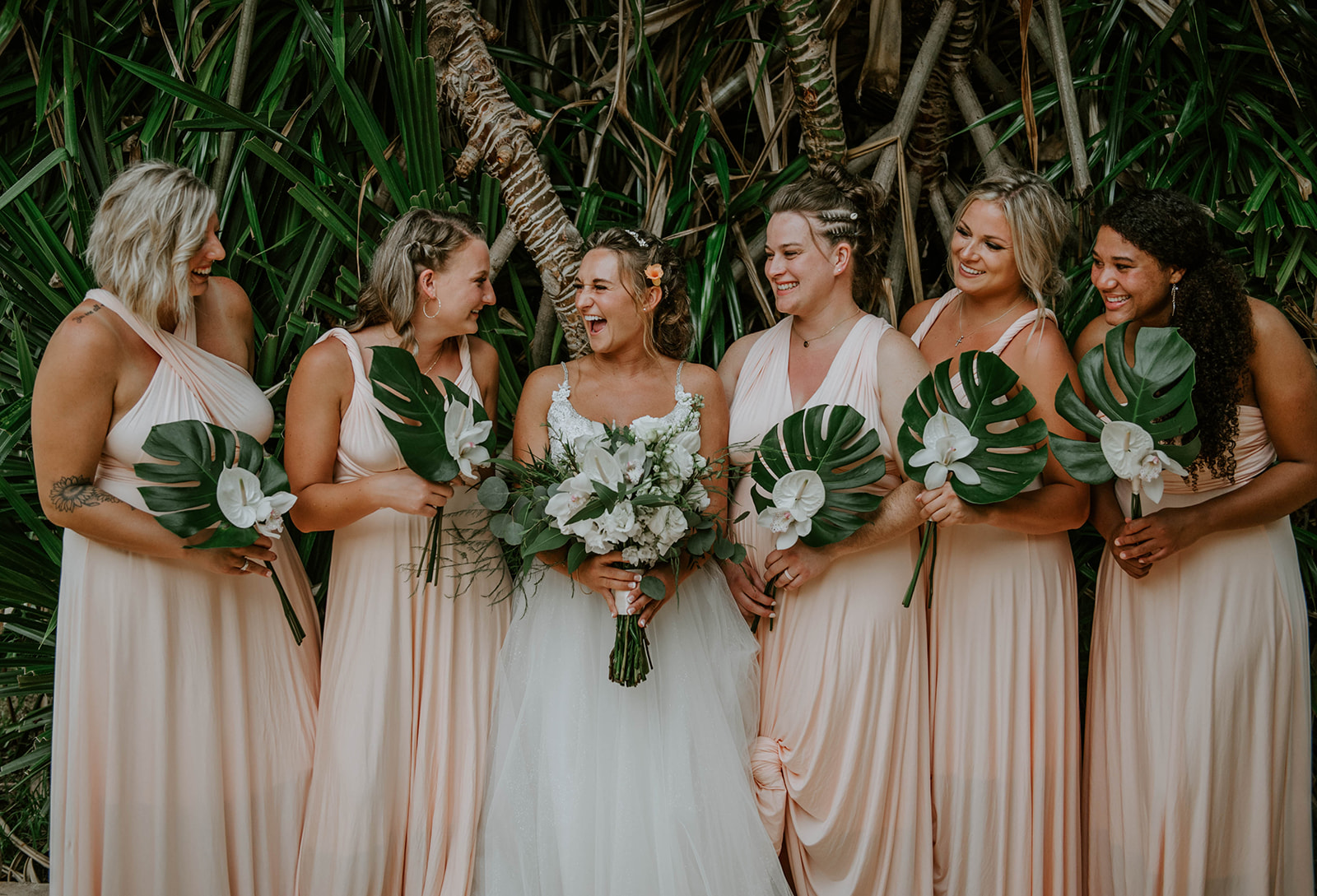 Blush white and green tropical wedding party
