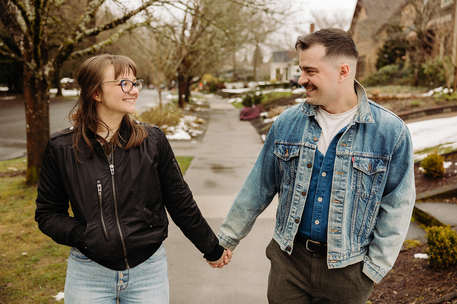 Couple goes for a short walk right outside their house during their at home engagement photo session