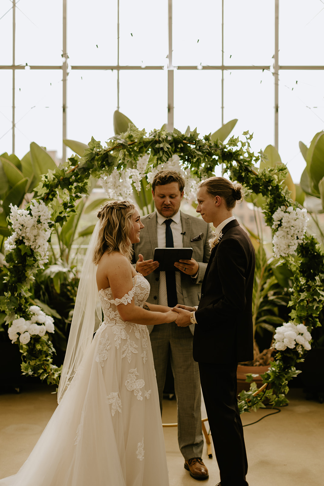 A couple getting married at the Downtown Market greenhouse in Grand Rapids, Michigan
