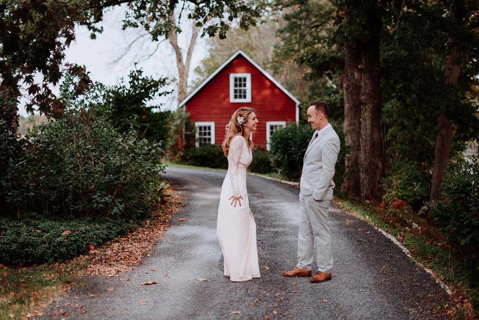 First Look between Natalie and Mike on the foot path along the river in front of the little red barn.