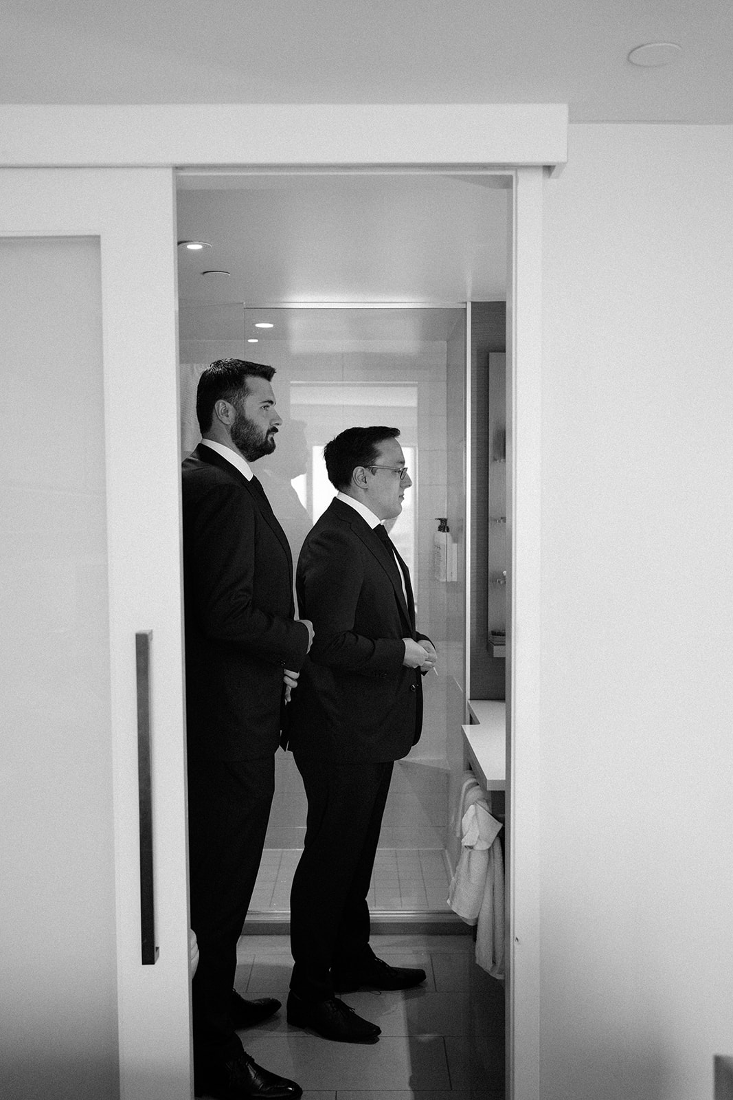 Portrait of two men getting ready for the wedding ceremony.