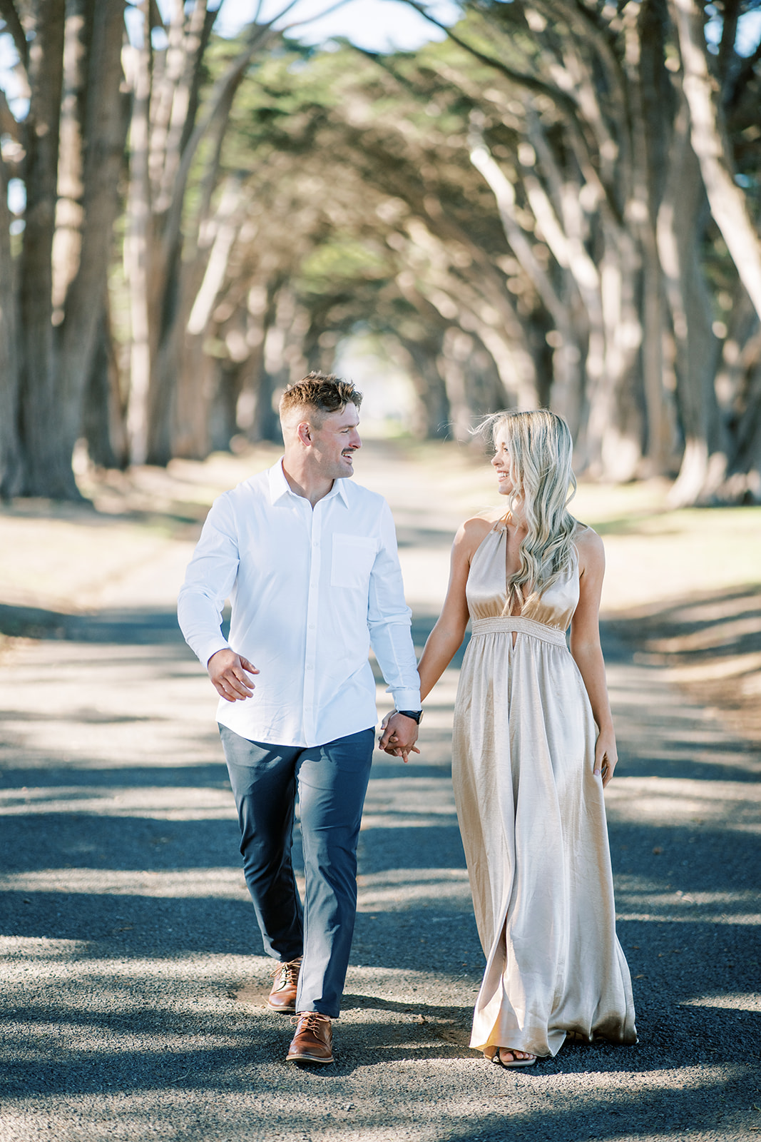 Engagement couple at Cypress tree tunnel at Point Reyes CA formal dress
