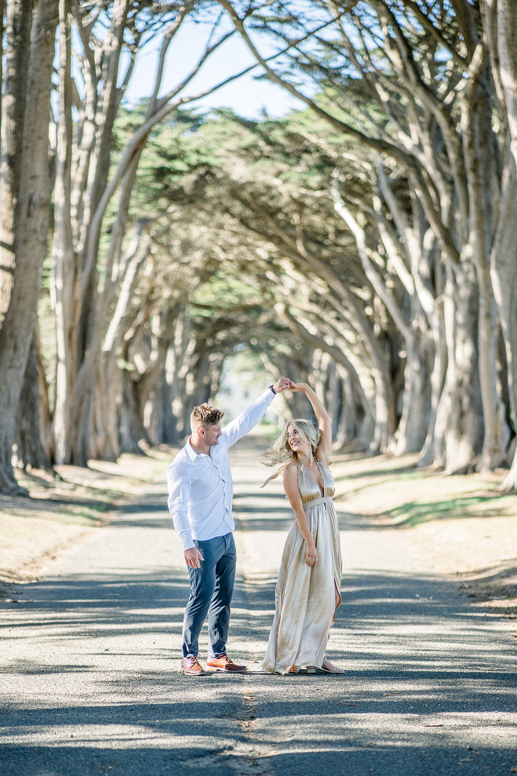 Spin Engagement couple at Cypress tree tunnel at Point Reyes CA