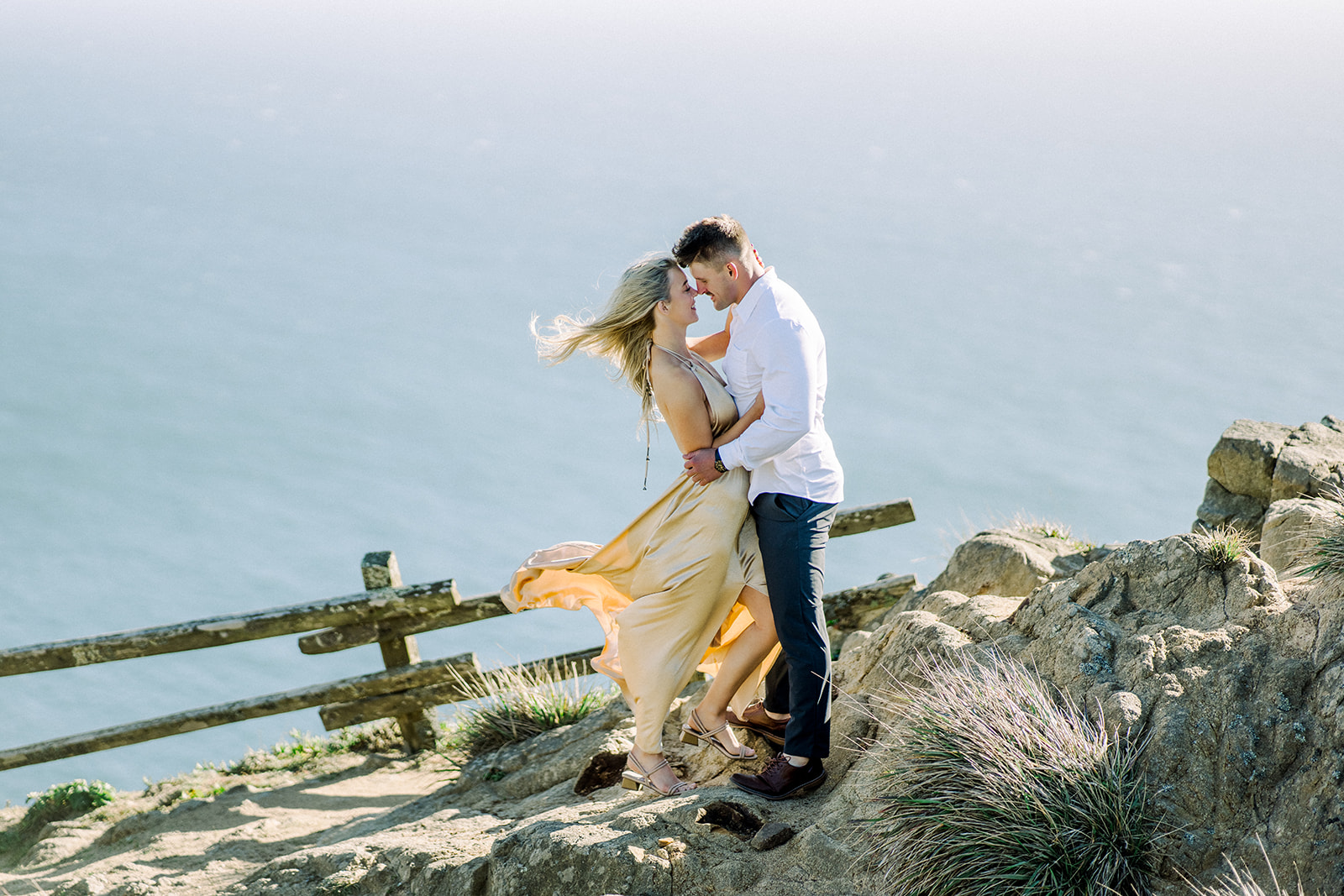 Windy Coastal Point Reyes, CA engagement session Photographer formal gold dress
