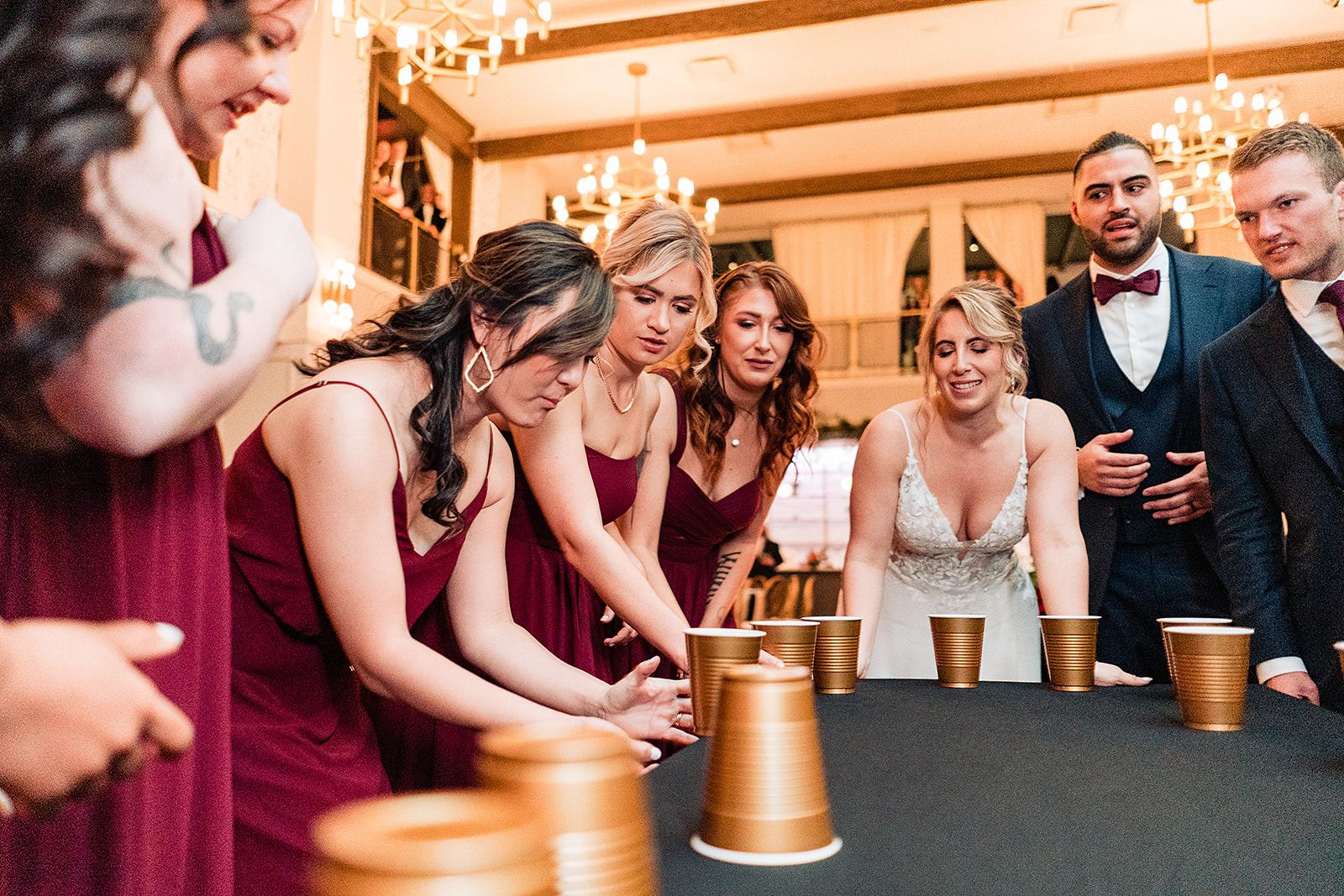 bridal party playing flip cup at the Lucy. 