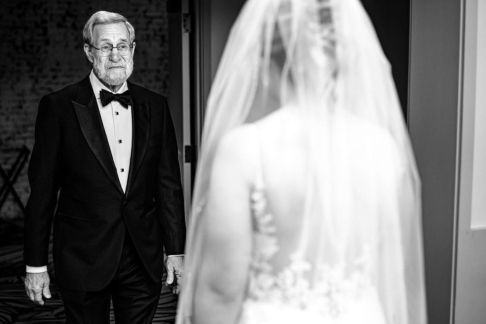father of bride sees daughter for the first time in the bridal suite at Cescaphe. 