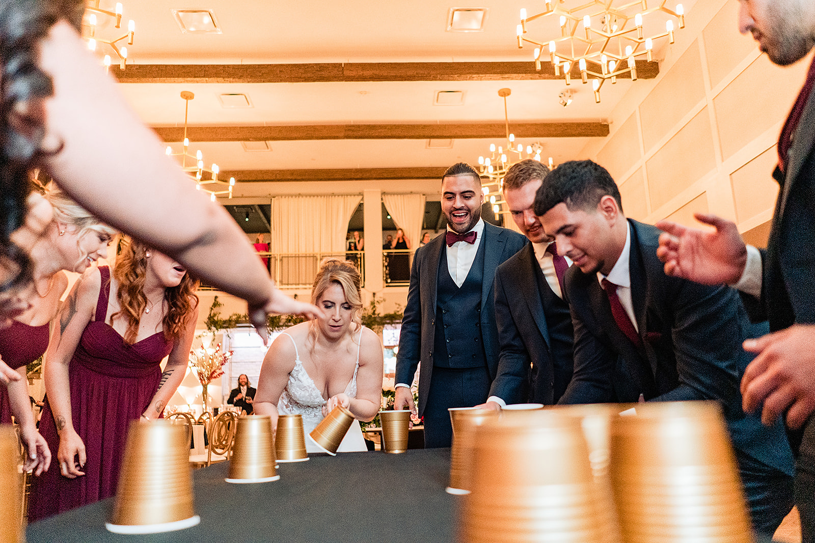 Flip cup game at the Lucy being played by the whole bridal party 