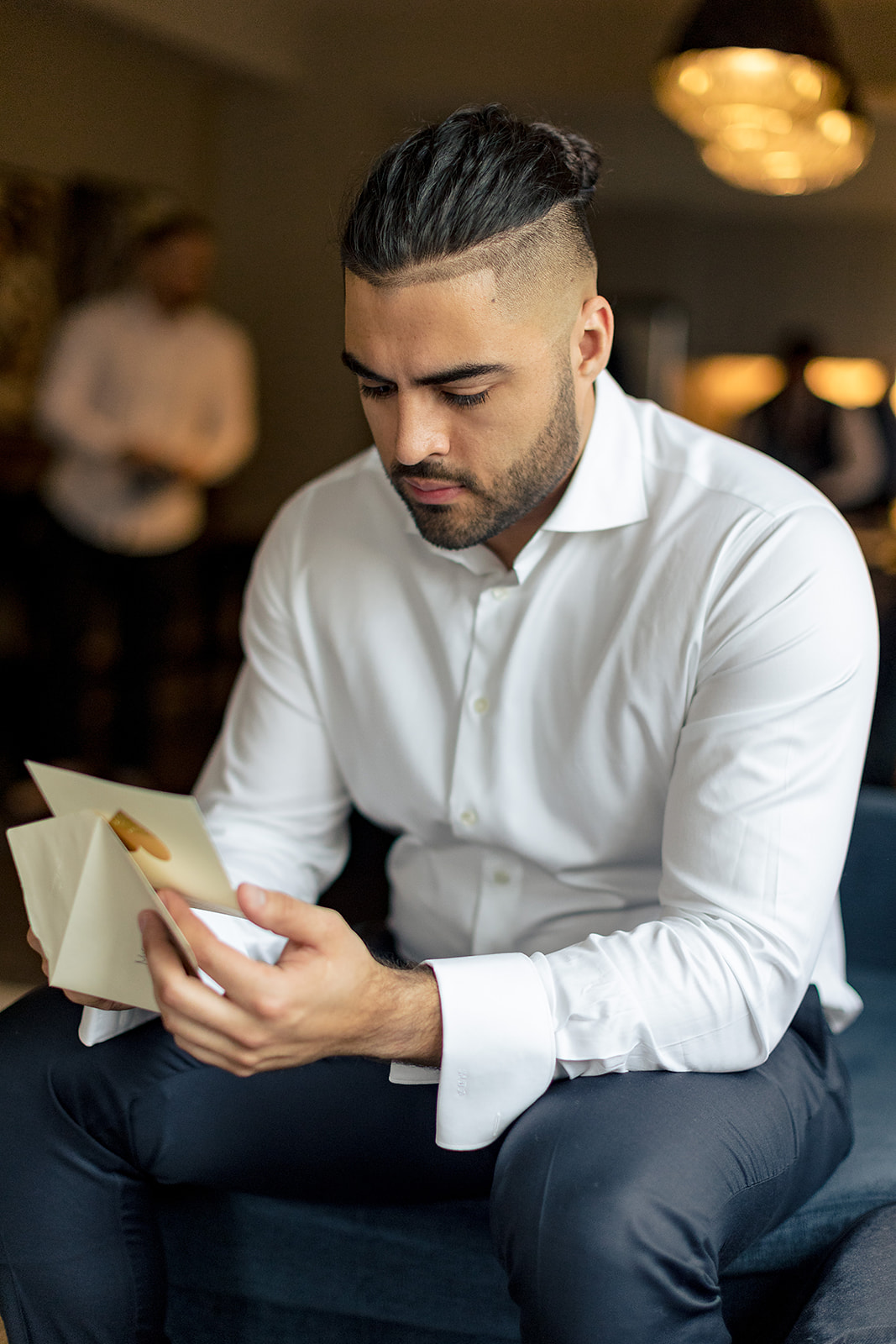 groom reading his card on his wedding day.