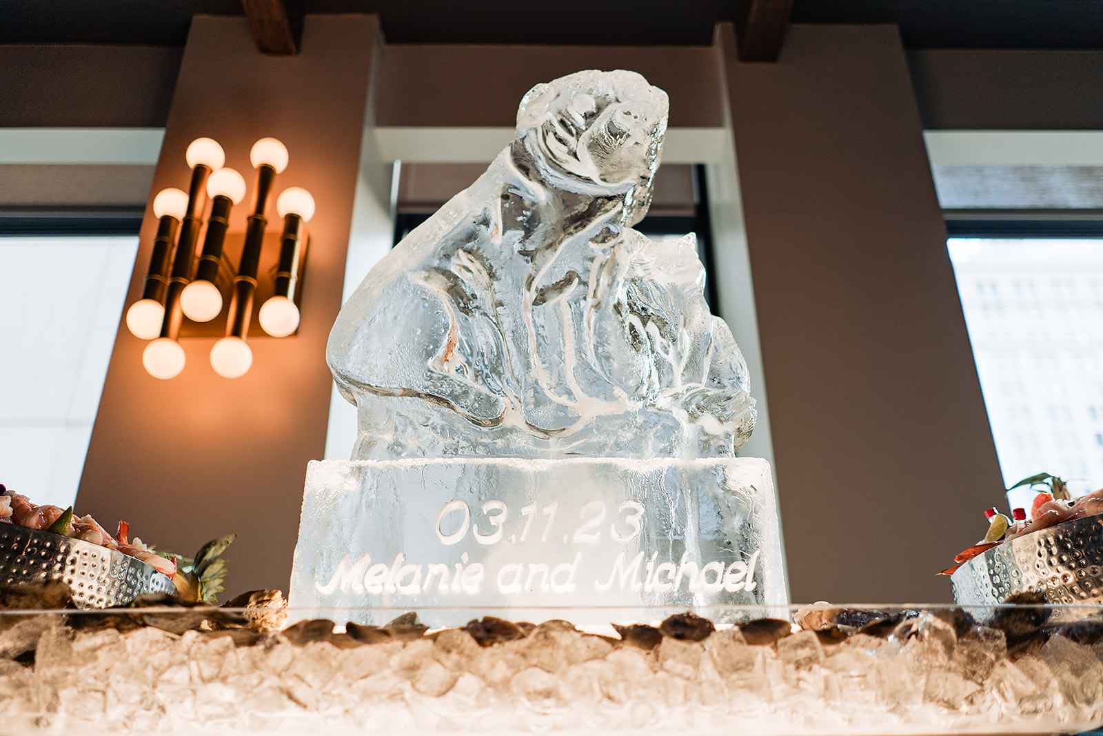 Ice sculpture of dogs at a Cescaphe cocktail hour.