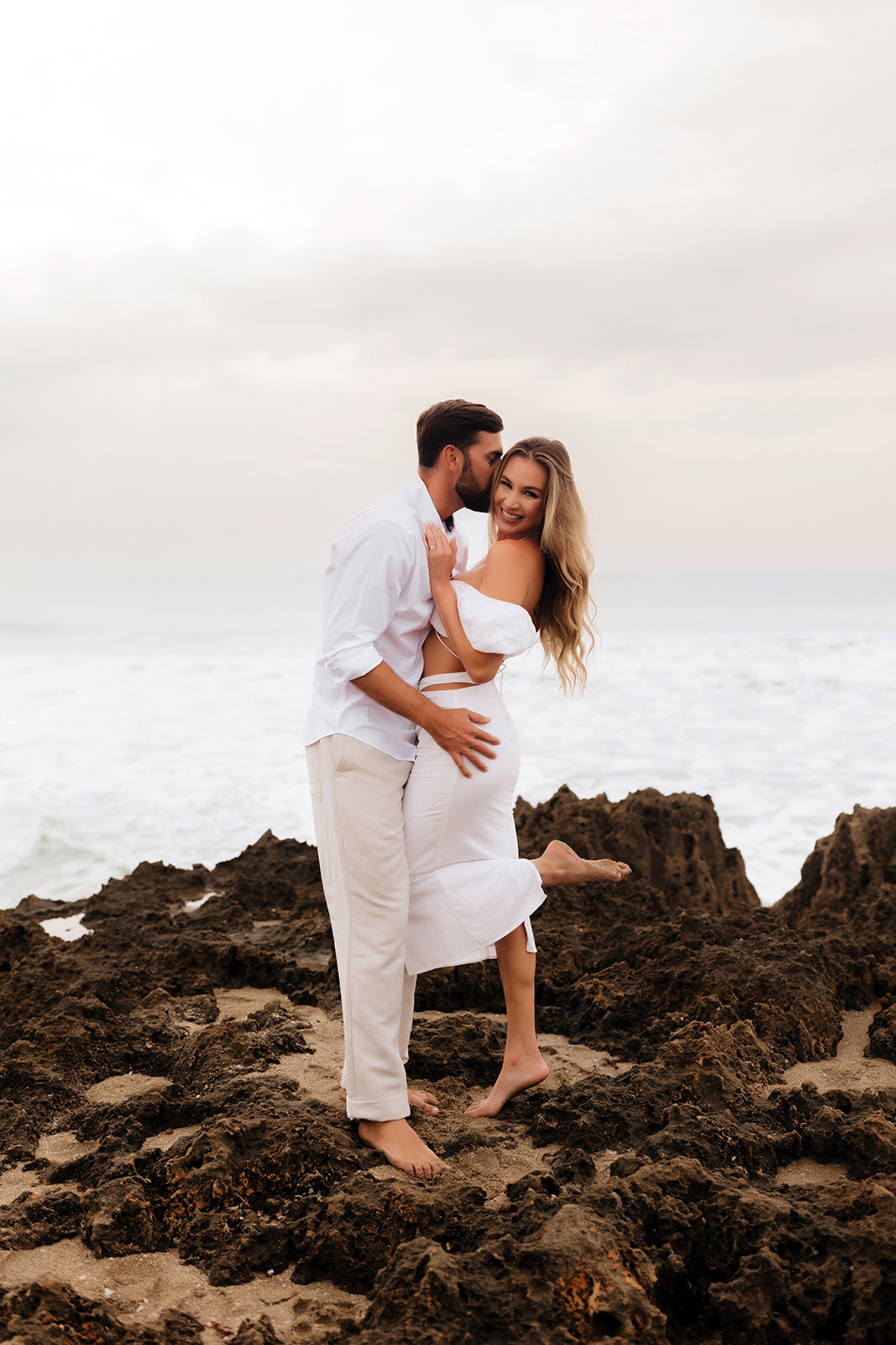 Rocky beach engagement session in Jupiter Florida 
