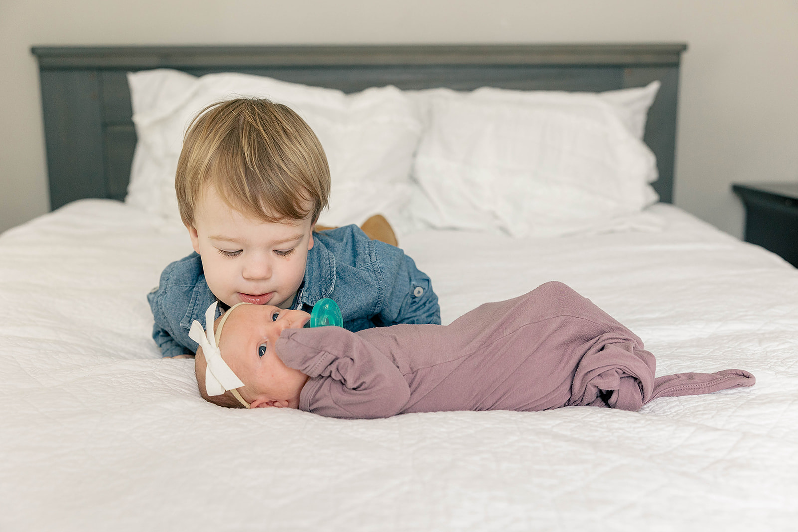bright and loving newborn session with toddler sibling