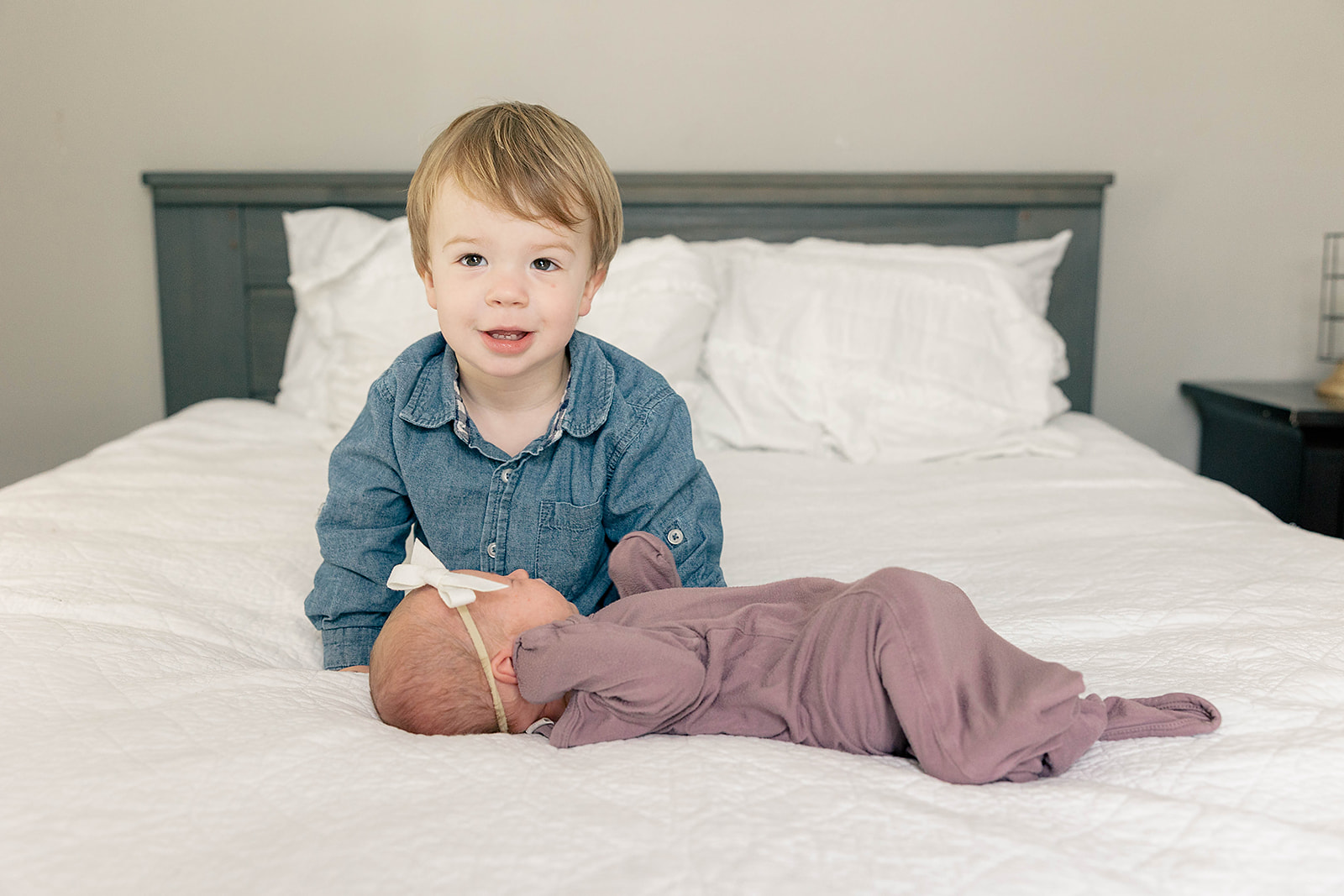 bright and playful newborn session with toddler sibling