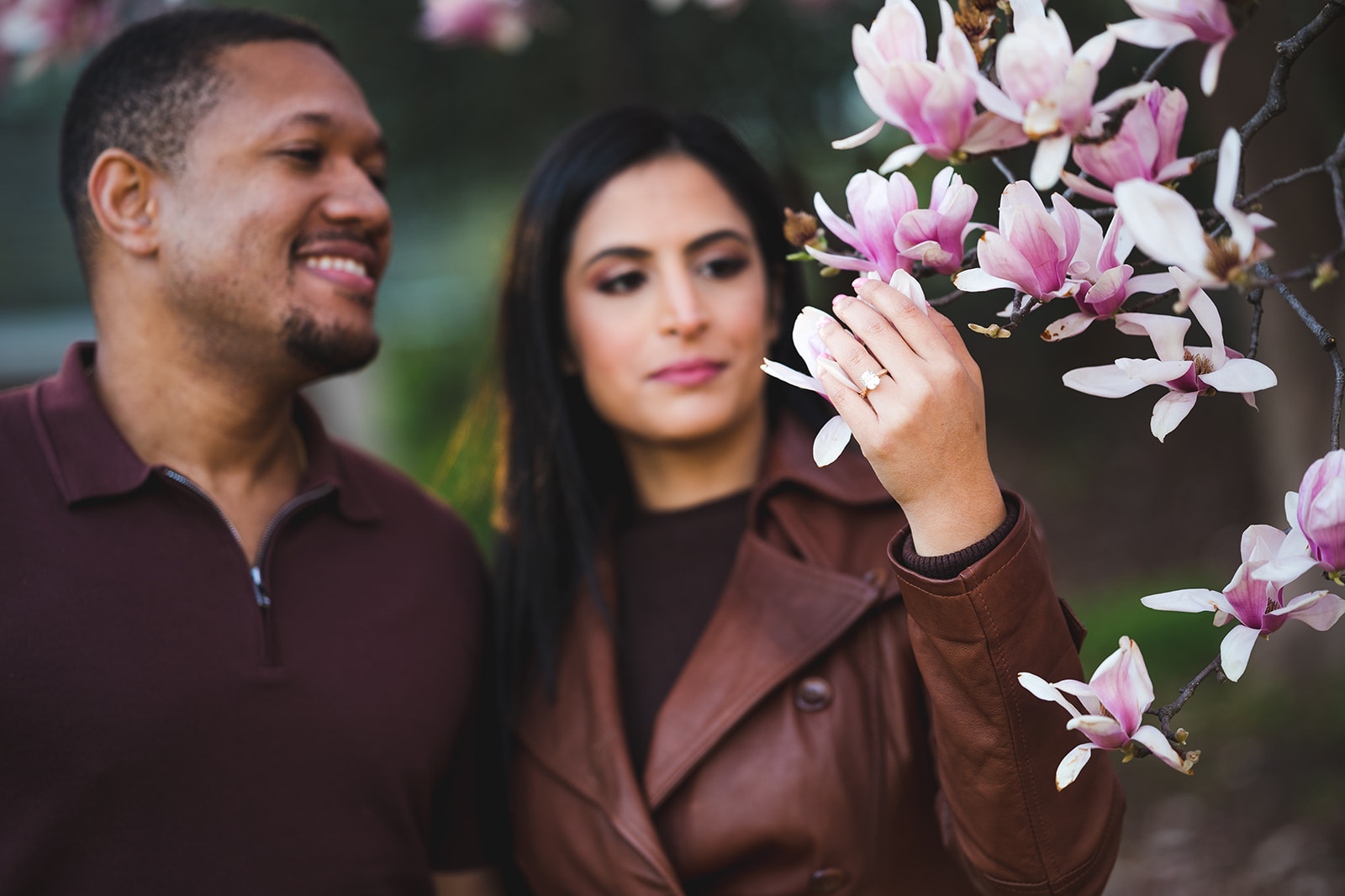 Engagement ring amid cherry blossoms by Gabriele Stonyte Photography