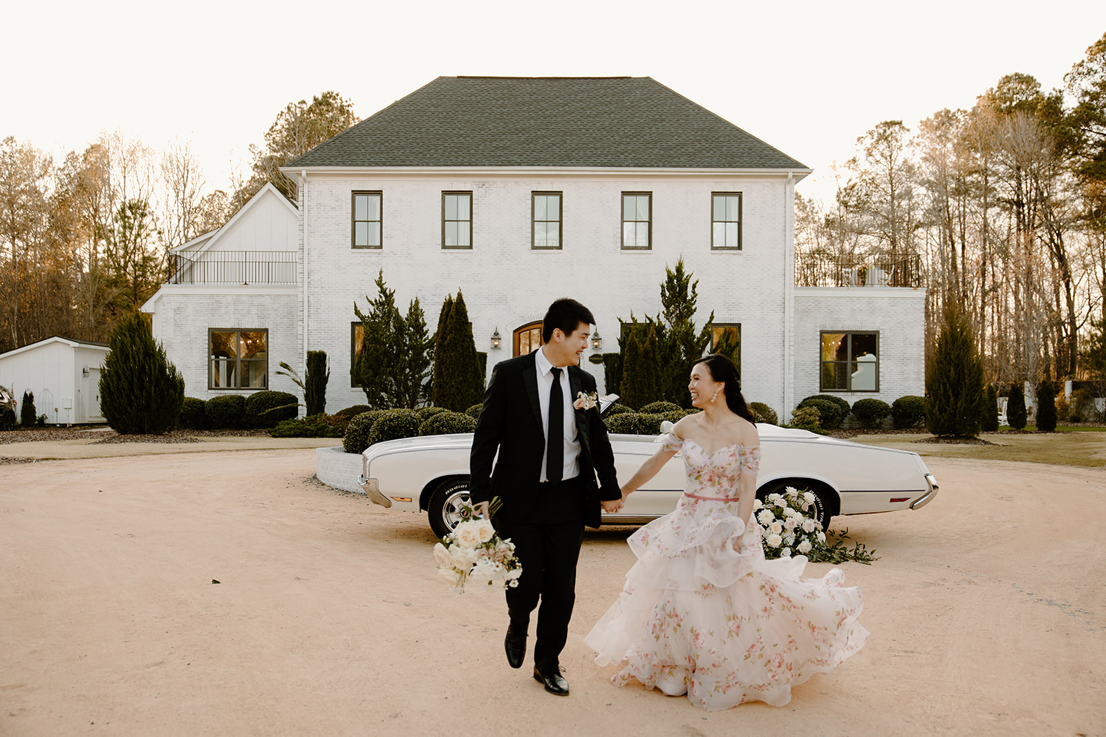 Candid wedding photos with classic car and floral wedding dress.