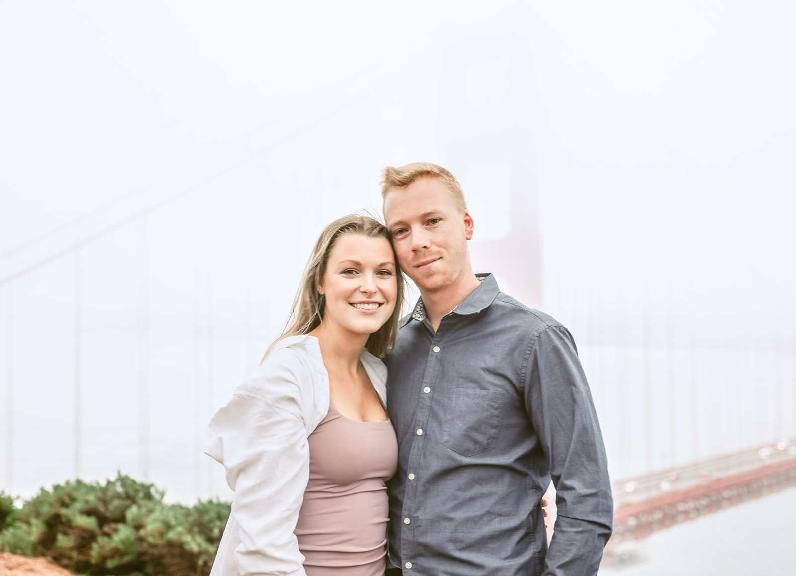 Proposal engagement photography at Battery Spencer with Golden Gate Bridge on a cloudy day in San Francisco