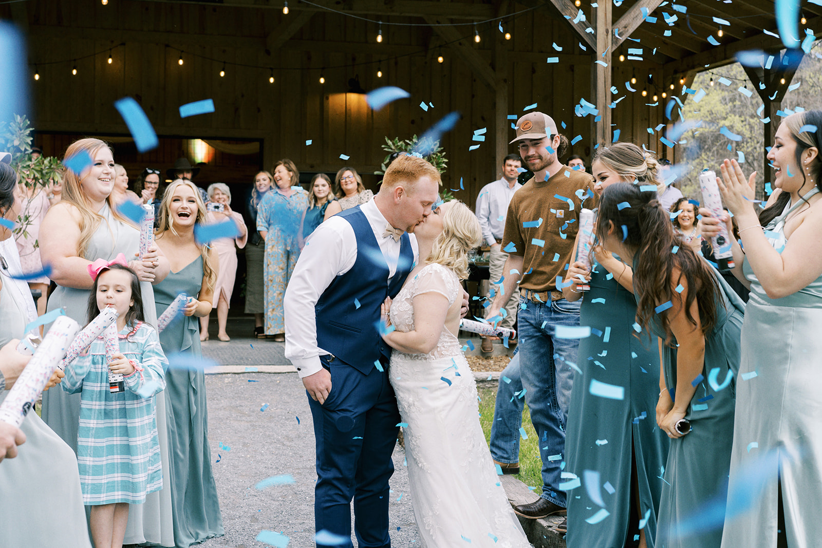 Confetti flies over the bride and groom during their exit at Dry Creek Chapel
