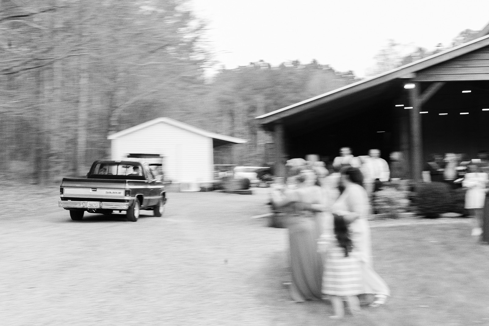 The bride and groom exit their wedding in an old Chevrolet truck at Dry Creek Chapel