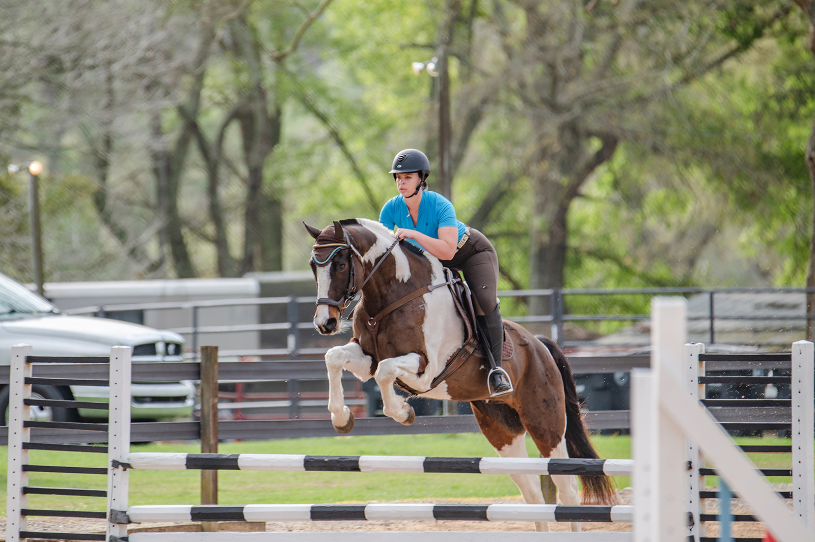 Equestrian competing in Show Jumping during Eventing competition in Tallahassee, FL at Mahan Farm. calicoandchrome.com