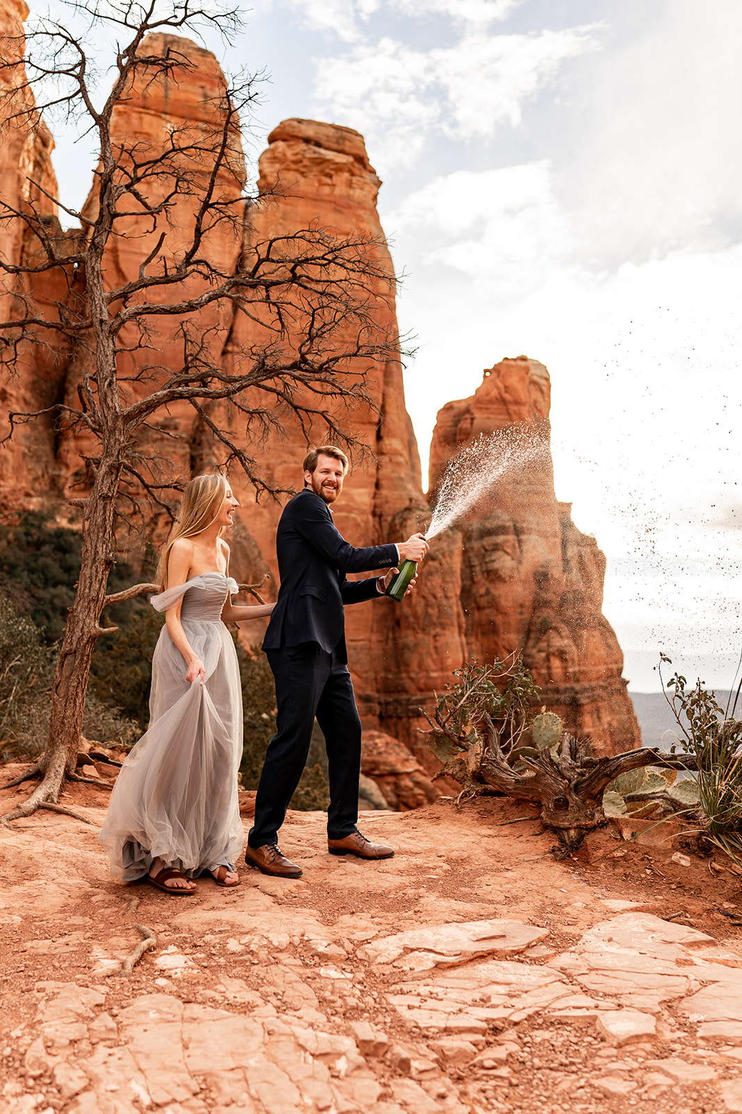 Elopement couple with champagne pop celebration at Cathedral Rock 