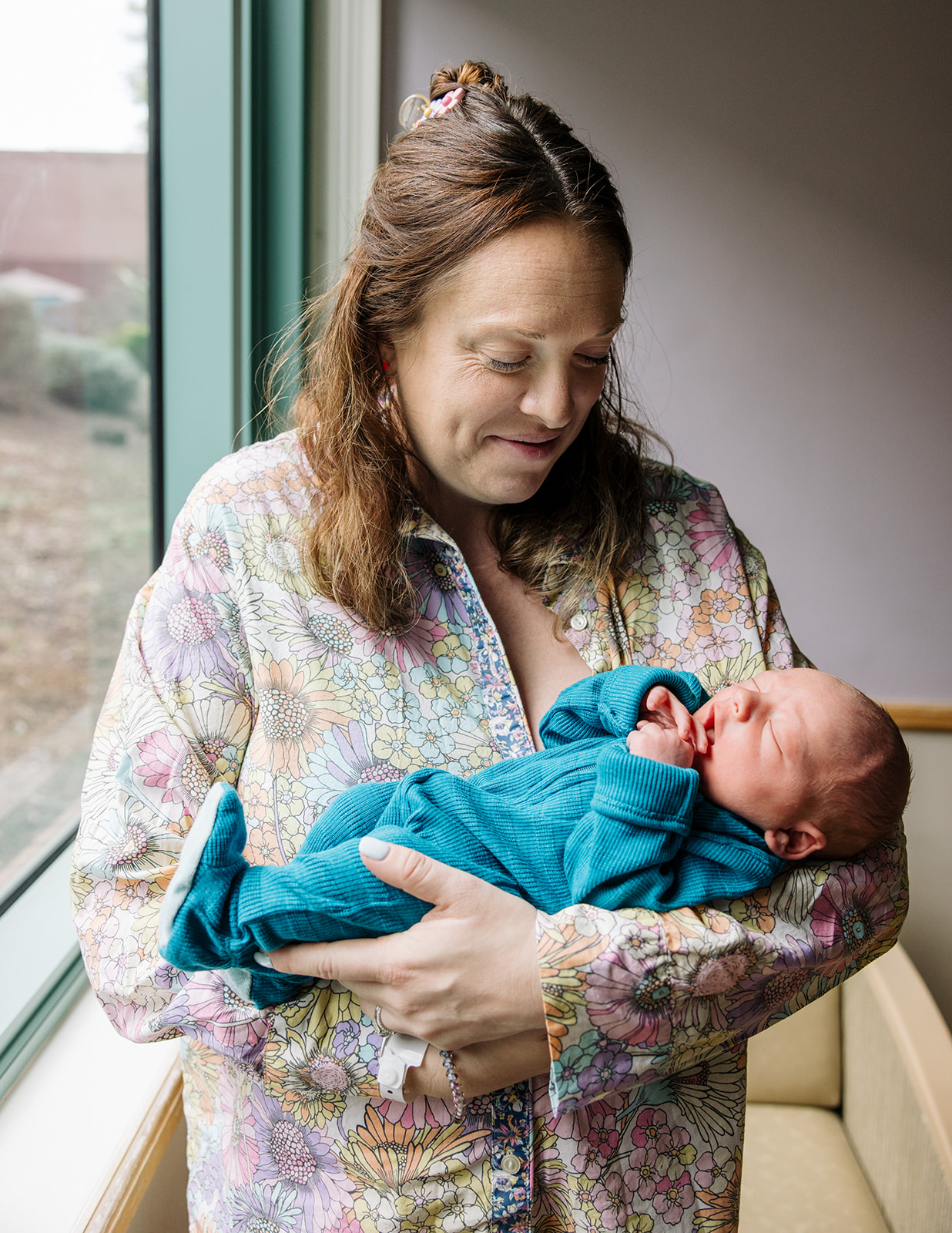 photo of mom holding newborn baby boy at El Camino Real Hospital in Mountain View California