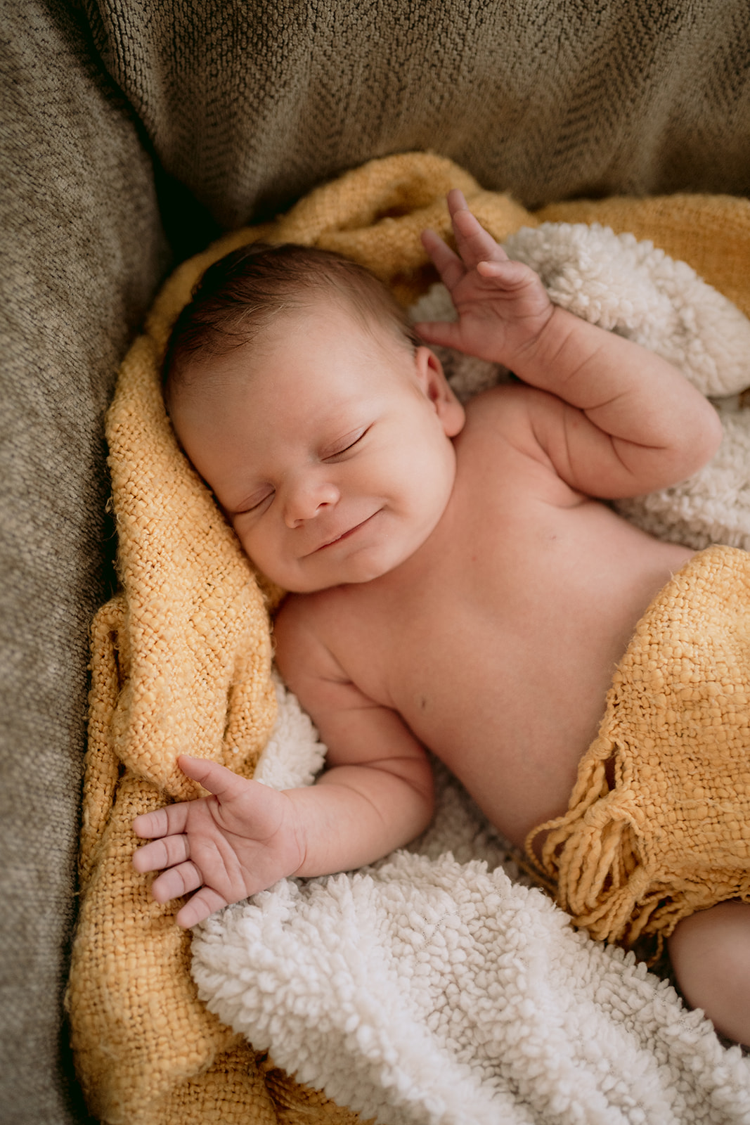 newborn baby smiling 
